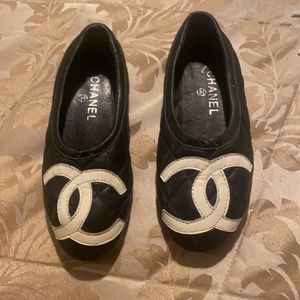 Black leather Chanel flats